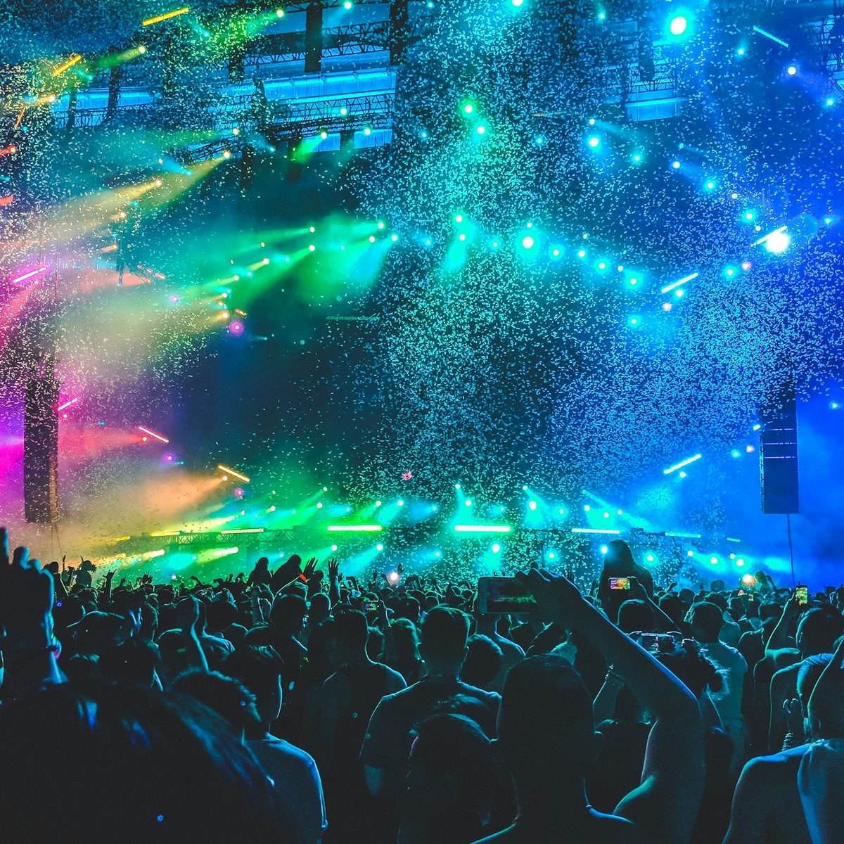 Concert stage under colourful spotlight beams